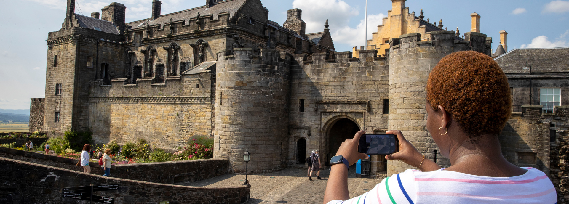 A student taking a photo of the entrance to Stirling Castle