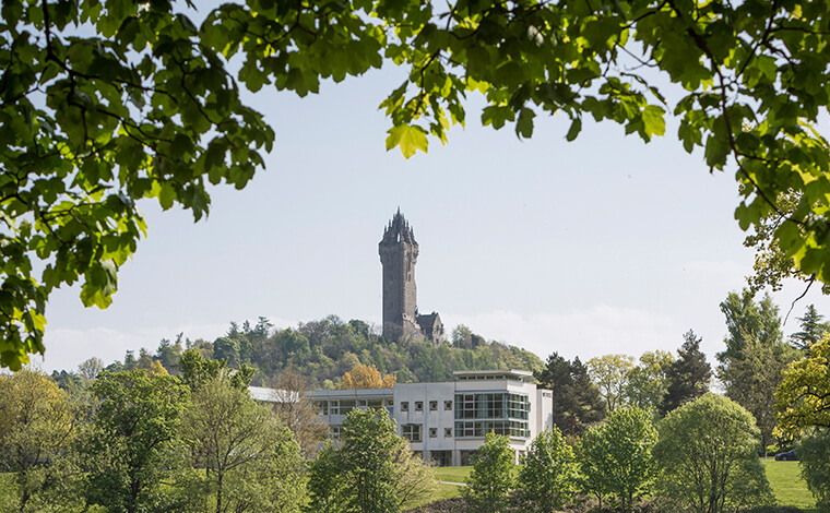 Image of the campus with the Wallace Monument in the background
