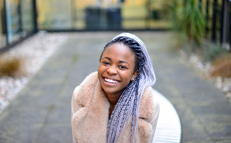 Female student form Zimbabwe smiling