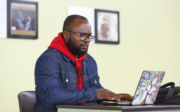 Postgraduate student using a laptop