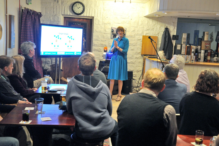 Professor Maggie Cusack presents to patrons of the Curly Coo, Stirling