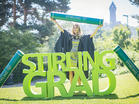 Graduate at Stirling Grad sign