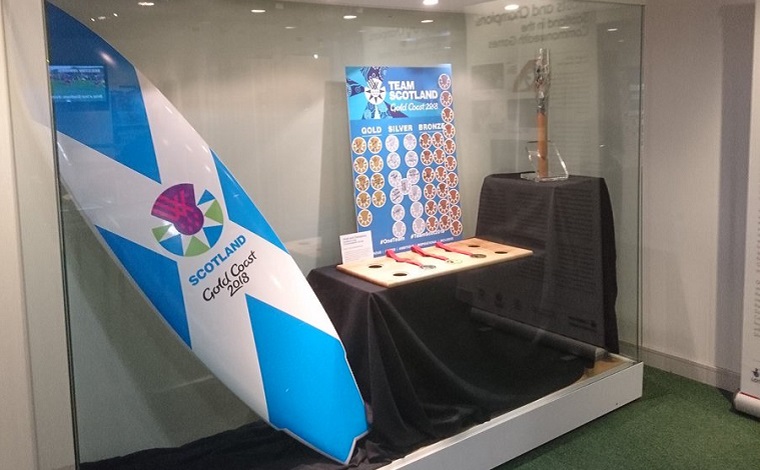 Team Scotland promotional surfboard in a display case