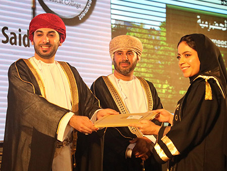 Student receiving award at Muscat, Oman graduation