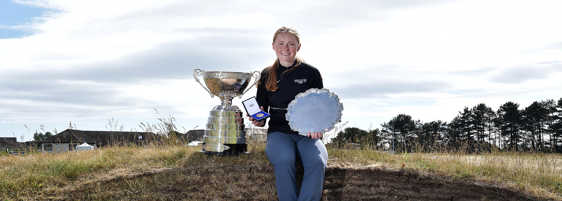 Louise Duncan with golf trophies