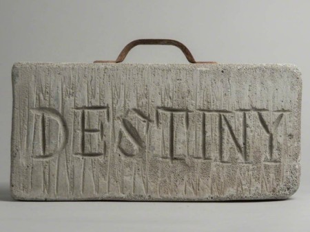 Stone of Destiny created by the artist George Wyllie. It is a portable, concrete breeze-block stone, featuring an aluminium handle and the word ‘Destiny’ on one side