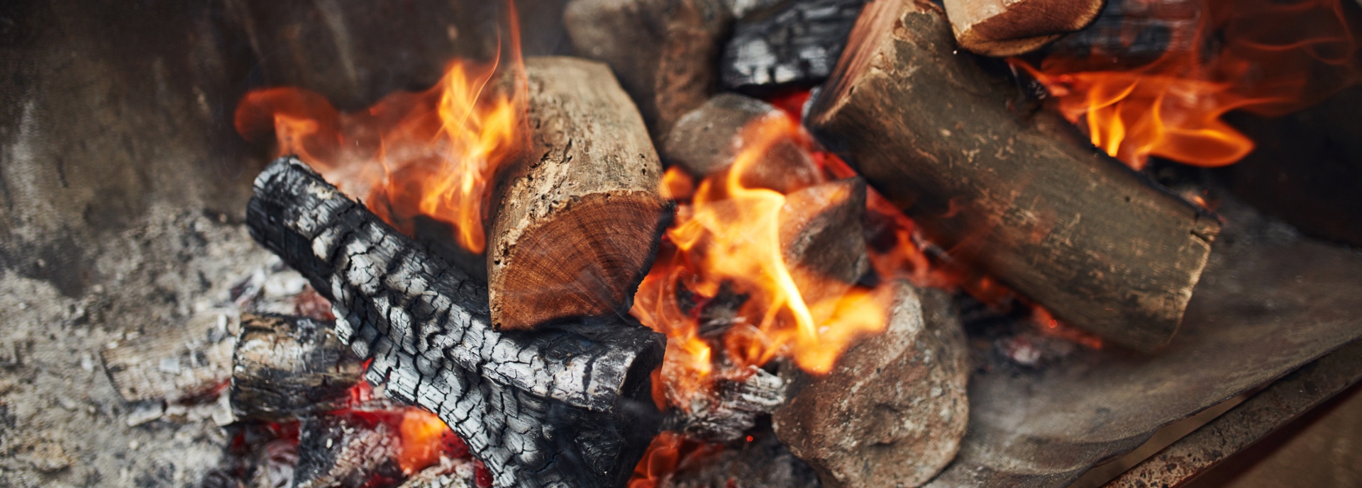 Wooden logs and charcoal fire