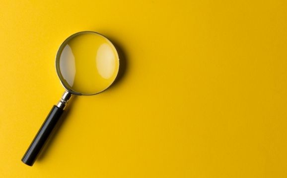 Magnifying Glass with yellow background